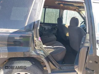 1997 Jeep Grand Cherokee Laredo with VIN 1J4GZ58S4VC633205, listed as a IAAI auction lot 41727571 with 201,228 mi miles. Bid and sale history available at carsss.com. Image 8.