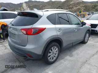2014 Mazda CX-5 Touring with VIN JM3KE2CY3E0429025, listed as a IAAI auction lot 41680713 with 113,065 mi miles. Bid and sale history available at carsss.com. Image 4.