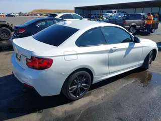 2016 BMW 2 Series M235i with VIN WBA1J7C5XGV359562, listed as a IAAI auction lot 39990299 with 54,022 mi miles. Bid and sale history available at carsss.com. Image 4.