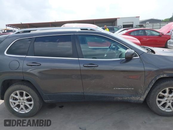 2015 Jeep Cherokee Latitude z VIN 1C4PJMCS2FW601271, wystawiony jako IAAI lot #41969742 z przebiegiem 94 224 mil mil oraz . Historia ofert i sprzedaży dostępna na DreamBid. Obrazek 13.