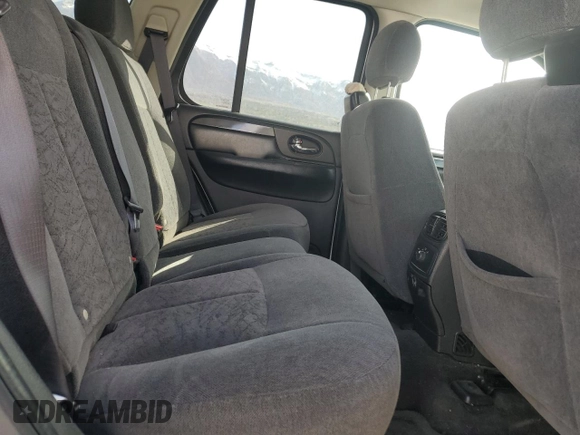2006 GMC Envoy SLE z VIN 1GKDT13S462156541, wystawiony jako Copart lot #52500615 z przebiegiem 140 558 mil mil oraz Szkody całkowita. Historia ofert i sprzedaży dostępna na DreamBid. Obrazek 12.