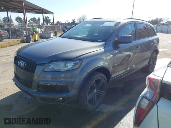 2014 Audi Q7 3.0T S line Prestige with VIN WA1DGAFE2ED009086, listed as a IAAI auction lot 41824179 with 136,899 mi miles. Bid and sale history available at carsss.com. Image 2.