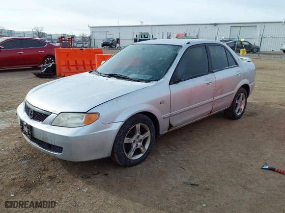 2003 Mazda Protege DX with VIN JM1BJ225830202261, listed as a IAAI auction lot 41273338 with 163,003 mi miles. Bid and sale history available at carsss.com. Image 2.