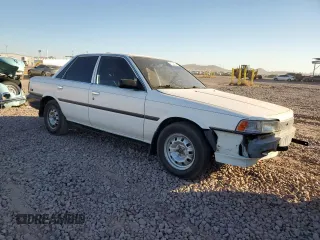 1989 Toyota Camry z VIN 4T1SV24E5KU019985, wystawiony jako Copart lot #81200104 z przebiegiem 207 103 mil mil oraz Szkoda całkowita • Salvage title. Historia ofert i sprzedaży dostępna na DreamBid. Obrazek 4.
