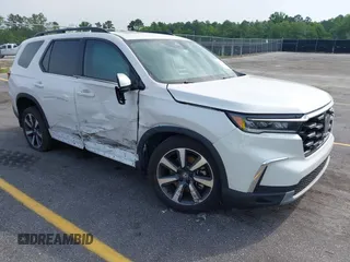 2024 Honda Pilot Touring z VIN 5FNYG1H70RB048165, wystawiony jako IAAI lot #42281381 z przebiegiem 21 482 mil mil oraz . Historia ofert i sprzedaży dostępna na DreamBid. Obrazek 1.