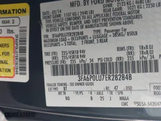 2014 Ford Fusion SE Hybrid with VIN 3FA6P0LU7ER282848, listed as a IAAI auction lot 41560449 with 180,696 mi miles. Bid and sale history available at carsss.com. Image 9.