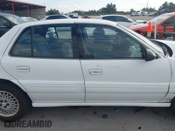 1997 Pontiac Grand Am SE with VIN 1G2NE52T3VC809661, listed as a IAAI auction lot 41100711 with 168,686 mi miles and . Bid and sale history available at DreamBid. Image 13.