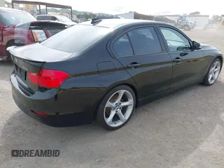 2012 BMW 3 Series 328i with VIN WBA3A5C56CF345904, listed as a IAAI auction lot 41992572 with 136,672 mi miles. Bid and sale history available at carsss.com. Image 4.