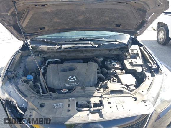 2014 Mazda CX-5 Grand Touring with VIN JM3KE2DY7E0376389, listed as a IAAI auction lot 42014946 with 126,081 mi miles. Bid and sale history available at carsss.com. Image 10.