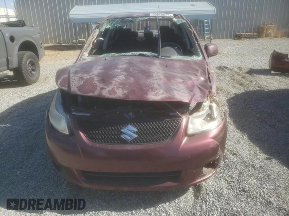2011 Suzuki SX4 LE with VIN JS2YC5A21B6303222, listed as a Copart auction lot 50426895 with 56,236 mi miles and Salvage Title. Bid and sale history available at carsss.com. Image 5.
