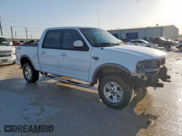 2002 Ford F-150 XLT with VIN 1FTRW08692KD89789, listed as a Copart auction lot 52621555 with 150,012 mi miles and Salvage Title. Bid and sale history available at carsss.com. Image 4.
