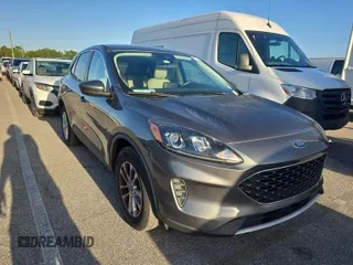 2021 Ford Escape SE with VIN 1FMCU9G69MUA42712, listed as a IAAI auction lot 42036251 with 26,476 mi miles. Bid and sale history available at carsss.com. Image 1.