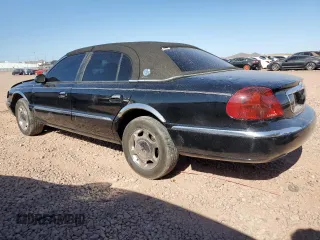 2001 Lincoln Continental with VIN 1LNHM97V61Y604213, listed as a Copart auction lot 52517535 with 112,391 mi miles and Salvage Title. Bid and sale history available at DreamBid. Image 2.