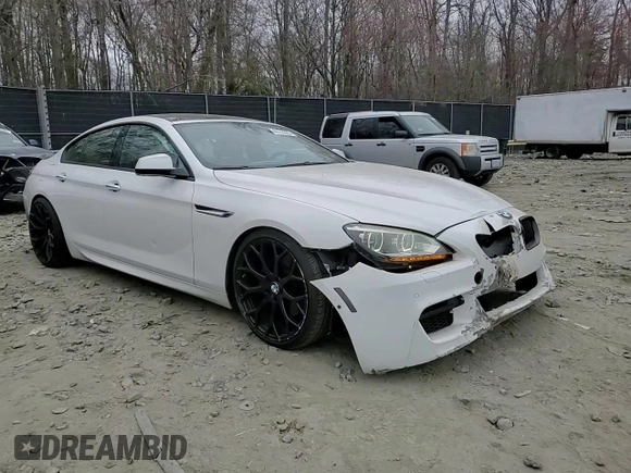 2014 BMW 6 Series 650i xDrive z VIN WBA6B4C54ED371324, wystawiony jako Copart lot #49016325 z przebiegiem 113 395 mil mil oraz Szkoda całkowita • Salvage title. Historia ofert i sprzedaży dostępna na DreamBid. Obrazek 11.