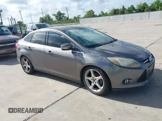 2014 Ford Focus Titanium with VIN 1FADP3J24EL236273, listed as a IAAI auction lot 42830158 with Not provided miles and . Bid and sale history available at DreamBid. Image 1.