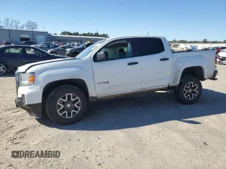 2021 GMC Canyon 4WD AT4 z VIN 1GTG6FEN7M1294890, wystawiony jako Copart lot #48194265 z przebiegiem Nie podano mil oraz Szkody całkowita. Historia ofert i sprzedaży dostępna na DreamBid. Obrazek 1.