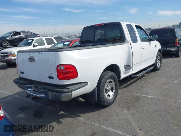 2001 Ford F-150 XL with VIN 1FTRX07L91KA77460, listed as a IAAI auction lot 41686519 with 185,286 mi miles. Bid and sale history available at carsss.com. Image 4.