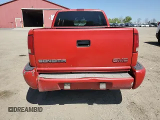 2000 GMC Sonoma SLS z VIN 1GTCS19W0Y8262960, wystawiony jako Copart lot #56512435 z przebiegiem 243 662 mil mil oraz Tytuł czysty. Historia ofert i sprzedaży dostępna na DreamBid. Obrazek 6.