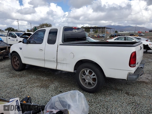 2002 Ford F-150 XL with VIN 1FTRX17W22KC53704, listed as a Copart auction lot 49179545 with 182,629 mi miles and Clean Title. Bid and sale history available at carsss.com. Image 2.