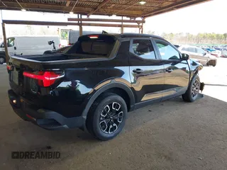 2022 Hyundai Santa Cruz SEL z VIN 5NTJCDAE7NH018858, wystawiony jako IAAI lot #42038182 z przebiegiem 28 596 mil mil oraz . Historia ofert i sprzedaży dostępna na DreamBid. Obrazek 4.