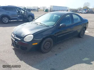 2004 Dodge Neon SE with VIN 1B3ES26C14D557254, listed as a IAAI auction lot 41906730 with 235,092 mi miles. Bid and sale history available at carsss.com. Image 2.