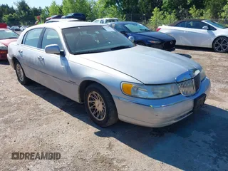 1998 Lincoln Town Car Signature with VIN 1LNFM82WXWY709328, listed as a IAAI auction lot 42145873 with 221,635 mi miles and . Bid and sale history available at DreamBid. Image 1.