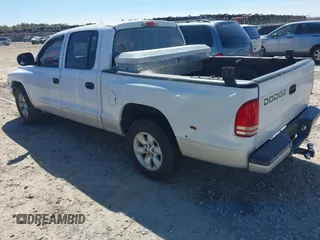 2004 Dodge Dakota SLT with VIN 1D7HL48K54S642754, listed as a IAAI auction lot 41875084 with 242,894 mi miles and . Bid and sale history available at carsss.com. Image 3.