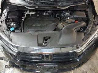 2021 Honda Odyssey Touring with VIN 5FNRL6H83MB040138, listed as a IAAI auction lot 39150096 with 61,322 mi miles and . Bid and sale history available at DreamBid. Image 10.
