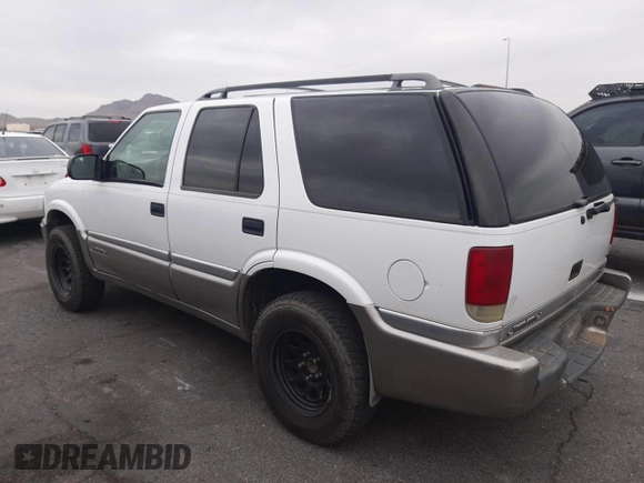 1999 GMC Jimmy SLE with VIN 1GKDT13W1X2551085, listed as a Copart auction lot 50553055 with 189,974 mi miles and Salvage Title. Bid and sale history available at carsss.com. Image 2.