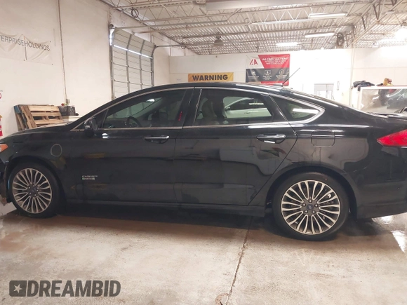 2017 Ford Fusion Titanium with VIN 3FA6P0SUXHR208653, listed as a IAAI auction lot 41312067 with 62,601 mi miles and . Bid and sale history available at DreamBid. Image 14.