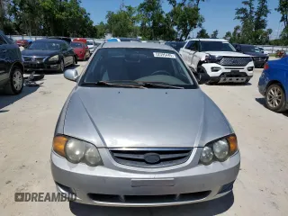 2004 Kia Spectra GS with VIN KNAFB161945141309, listed as a Copart auction lot 52395445 with 99,100 mi miles and Clean Title. Bid and sale history available at DreamBid. Image 5.