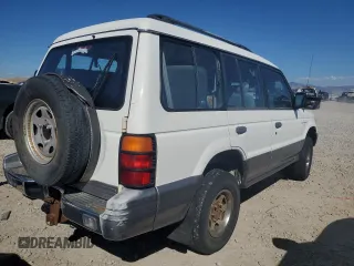 1995 Mitsubishi Montero z VIN JA4MR41H3SJ004800, wystawiony jako Copart lot #72036354 z przebiegiem 209 635 mil mil oraz Szkody całkowita. Historia ofert i sprzedaży dostępna na DreamBid. Obrazek 3.