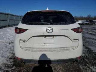 2021 Mazda CX-5 Grand Touring with VIN JM3KFBDM3M1305807, listed as a Copart auction lot 42713655 with 58,162 mi miles and Salvage Title. Bid and sale history available at DreamBid. Image 6.