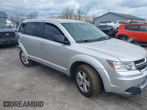 2013 Dodge Journey SE with VIN 3C4PDCAB9DT532554, listed as a IAAI auction lot 42026129 with 164,599 mi miles. Bid and sale history available at carsss.com. Image 1.