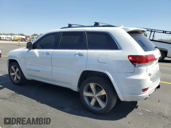2015 Jeep Grand Cherokee Overland with VIN 1C4RJFCM4FC618516, listed as a Copart auction lot 58671455 with 221,550 mi miles and Clean title. Bid and sale history available at DreamBid. Image 2.
