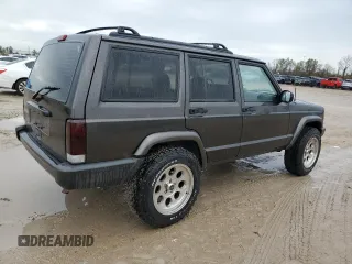 1999 Jeep Cherokee Sport with VIN 1J4FT68S2XL656679, listed as a Copart auction lot 88145875 with 254,038 mi miles and Salvage title. Bid and sale history available at DreamBid. Image 3.