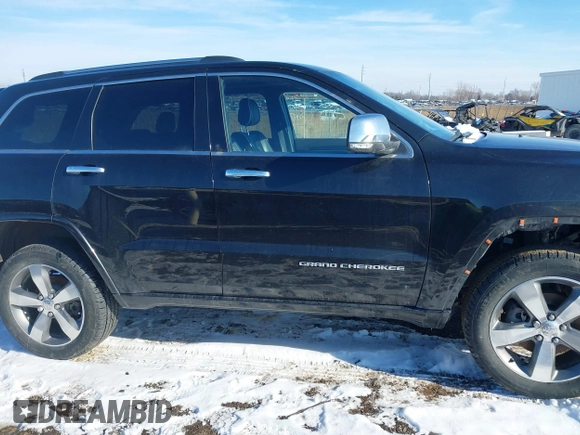 2015 Jeep Grand Cherokee Overland z VIN 1C4RJFCG3FC726748, wystawiony jako IAAI lot #41369715 z przebiegiem 120 905 mil mil oraz . Historia ofert i sprzedaży dostępna na DreamBid. Obrazek 13.