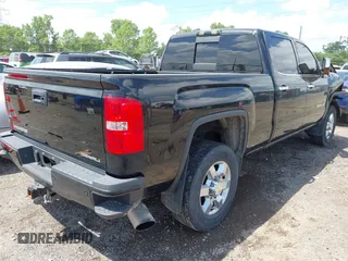 2015 GMC Sierra 2500HD Denali with VIN 1GT120E82FF574358, listed as a IAAI auction lot 42377676 with 86,097 mi miles and . Bid and sale history available at DreamBid. Image 4.