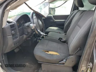 2012 Nissan Titan S z VIN 1N6AA0CJ9CN325160, wystawiony jako Copart lot #70004034 z przebiegiem 167 159 mil mil oraz Szkoda całkowita • Salvage title. Historia ofert i sprzedaży dostępna na DreamBid. Obrazek 7.