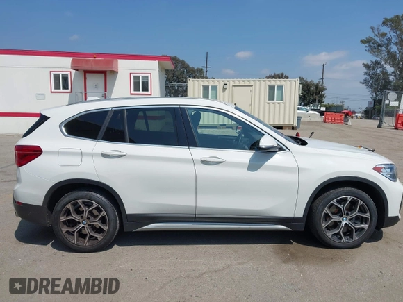 2021 BMW X1 sDrive28i z VIN WBXJG7C01M3M73496, wystawiony jako IAAI lot #42132005 z przebiegiem 23 278 mil mil oraz . Historia ofert i sprzedaży dostępna na DreamBid. Obrazek 13.