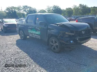 2014 Honda Ridgeline Sport z VIN 5FPYK1F77EB005980, wystawiony jako IAAI lot #42549044 z przebiegiem 320 768 mil mil oraz . Historia ofert i sprzedaży dostępna na DreamBid. Obrazek 1.