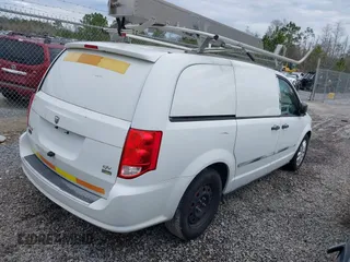 2014 Ram Cargo Van Tradesman with VIN 2C4JRGAG6ER389982, listed as a IAAI auction lot 41332110 with 133,351 mi miles. Bid and sale history available at carsss.com. Image 4.