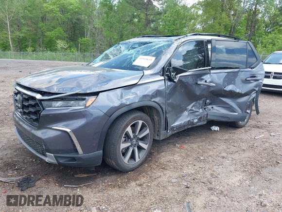 2024 Honda Pilot Touring with VIN 5FNYG2H7XRB014420, listed as a IAAI auction lot 41919635 with Not provided miles and . Bid and sale history available at DreamBid. Image 2.