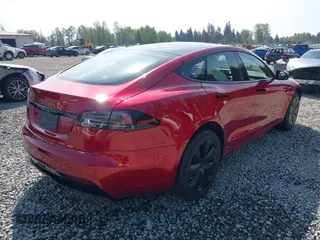 2023 Tesla Model S with VIN 5YJSA1E5XPF516779, listed as a IAAI auction lot 42110737 with 16,465 mi miles and . Bid and sale history available at DreamBid. Image 4.