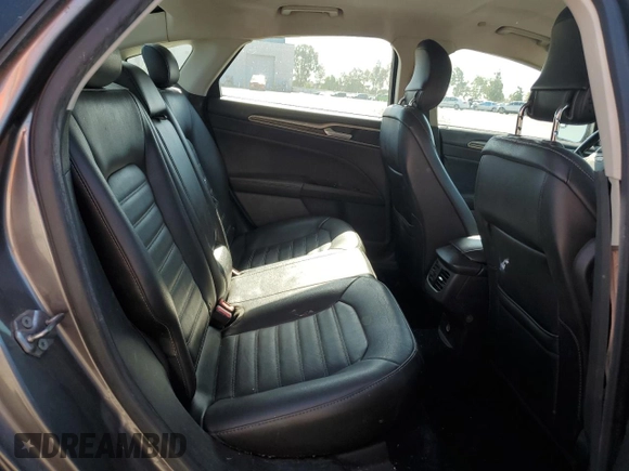 2013 Ford Fusion SE Hybrid z VIN 3FA6P0LU0DR274279, wystawiony jako Copart lot #57462315 z przebiegiem 272 825 mil mil oraz Szkoda całkowita • Salvage title. Historia ofert i sprzedaży dostępna na DreamBid. Obrazek 10.