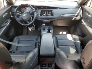 2019 Cadillac XT4 AWD Sport with VIN 1GYFZFR42KF136567, listed as a Copart auction lot 52018445 with 99,944 mi miles and Salvage title. Bid and sale history available at DreamBid. Image 8.