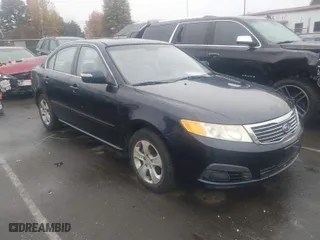 2009 Kia Optima LX with VIN KNAGE228095303047, listed as a IAAI auction lot 41128475 with 165,317 mi miles. Bid and sale history available at carsss.com. Image 1.