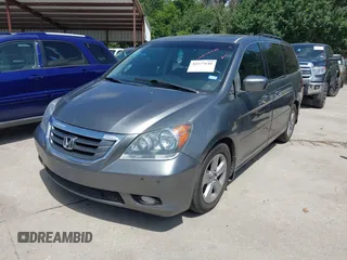 2010 Honda Odyssey Touring with VIN 5FNRL3H90AB053710, listed as a IAAI auction lot 42577646 with 255,351 mi miles and . Bid and sale history available at DreamBid. Image 2.