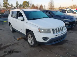 2014 Jeep Compass Latitude with VIN 1C4NJCEB4ED559713, listed as a IAAI auction lot 41653649 with 131,101 mi miles. Bid and sale history available at carsss.com. Image 1.
