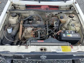 1983 Volkswagen Rabbit z VIN 1V1KG0170DV038002, wystawiony jako Copart lot #79815264 z przebiegiem 147 480 mil mil oraz Szkody całkowita. Historia ofert i sprzedaży dostępna na DreamBid. Obrazek 11.